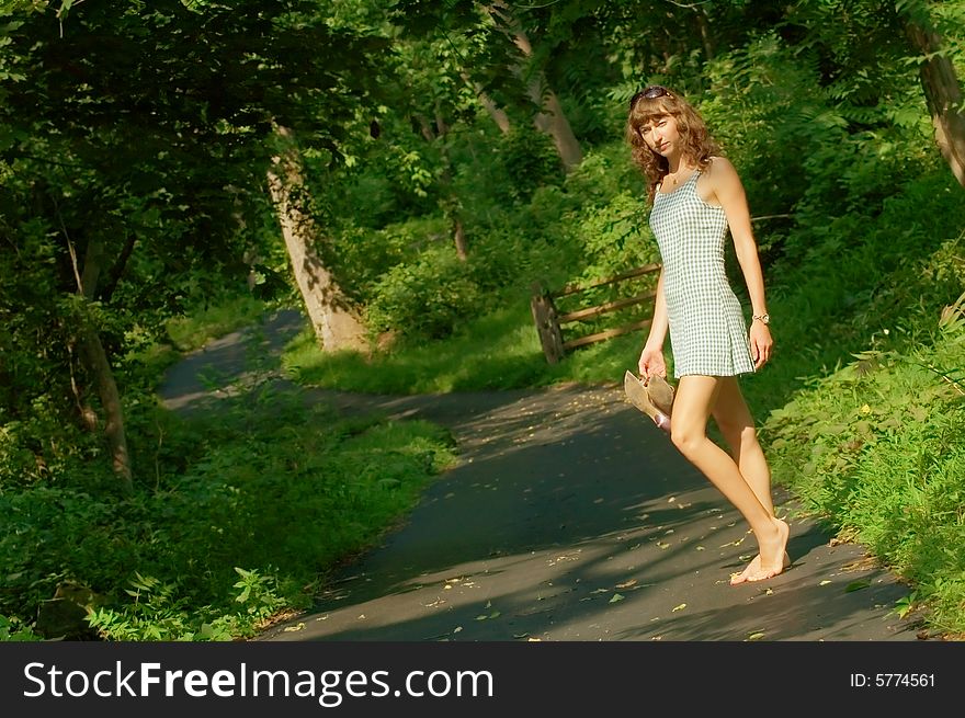 Pretty girl on forest path