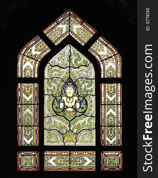 Thailand, the Wat Benchamabophit or the Marble temple in the city of Bangkok constructed in 1900 is faced with white Carrara marble. View of a decorated stained-glass window. Thailand, the Wat Benchamabophit or the Marble temple in the city of Bangkok constructed in 1900 is faced with white Carrara marble. View of a decorated stained-glass window
