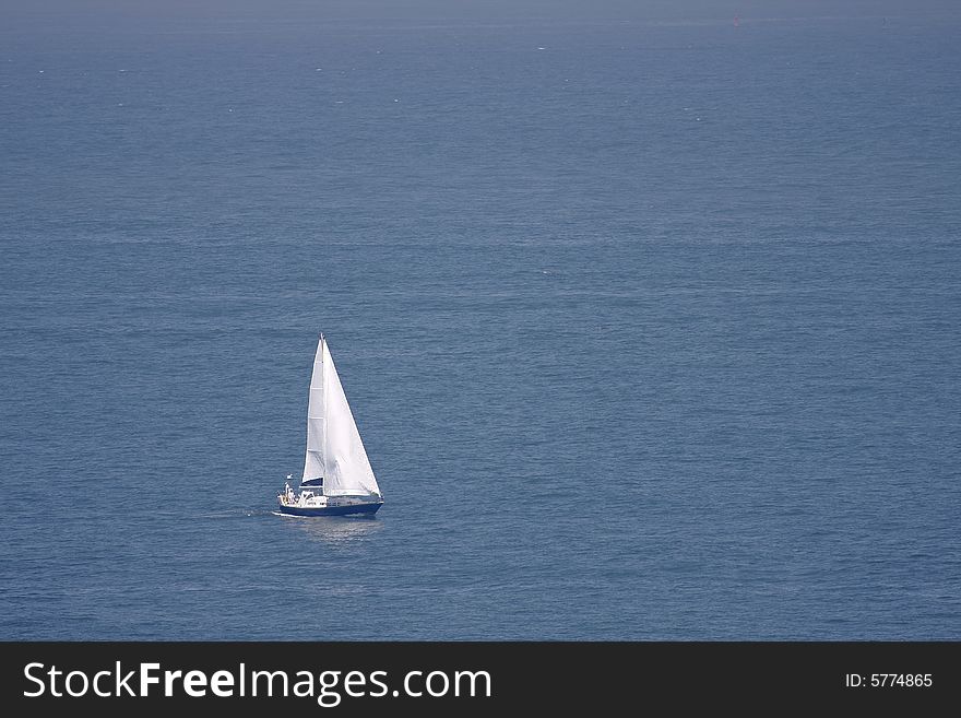 Two people sailing on the ocean. Two people sailing on the ocean