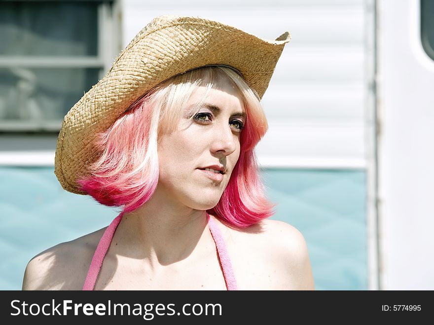 Woman In Front Of Travel Trailer