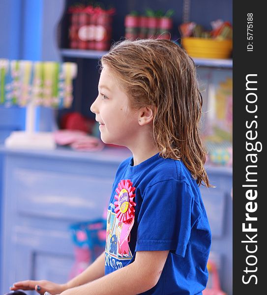 Little girl with wet hair waits to have her hair cut in boutique salon. Little girl with wet hair waits to have her hair cut in boutique salon.