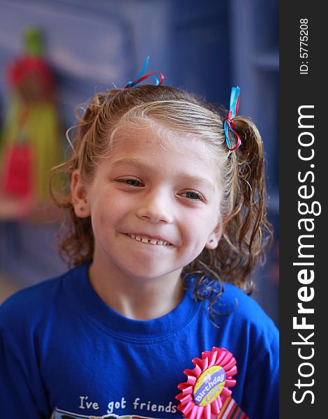 Little girl with curls has a new hairstyle complete with bows. Little girl with curls has a new hairstyle complete with bows