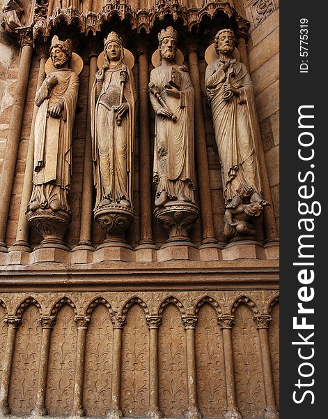 France, Paris: Notre Dame Our Lady is the most famous gothic cathedral. The construction is decorated with naturalist statues and stained-glass. View of the carved apostles. France, Paris: Notre Dame Our Lady is the most famous gothic cathedral. The construction is decorated with naturalist statues and stained-glass. View of the carved apostles