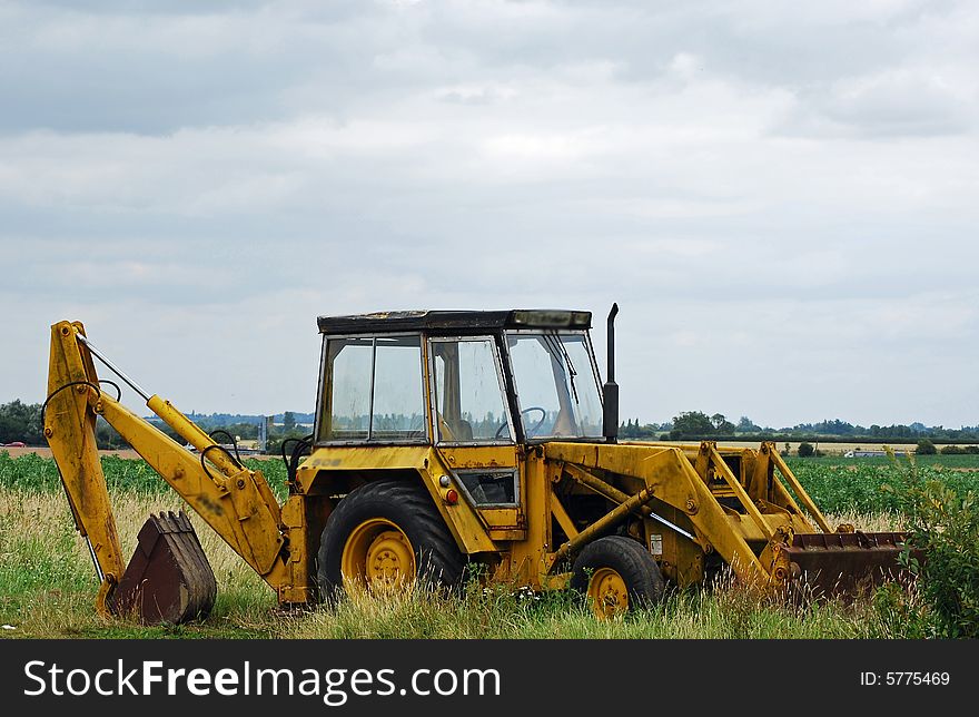 Shot of a farm tractor in a field. Shot of a farm tractor in a field