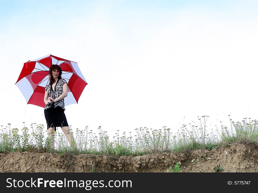 A beautiful girl and an umbrella. A beautiful girl and an umbrella