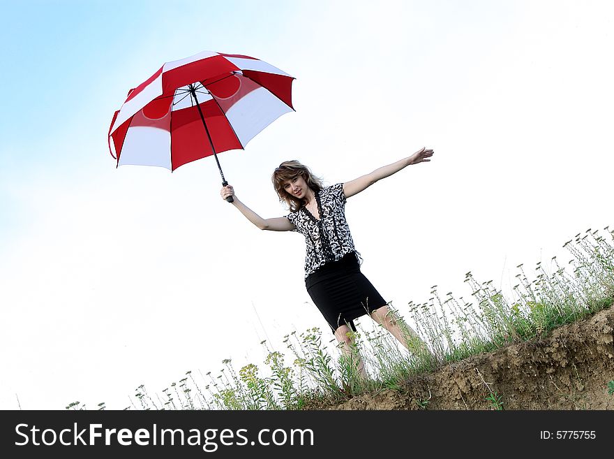 A beautiful girl and an umbrella. A beautiful girl and an umbrella