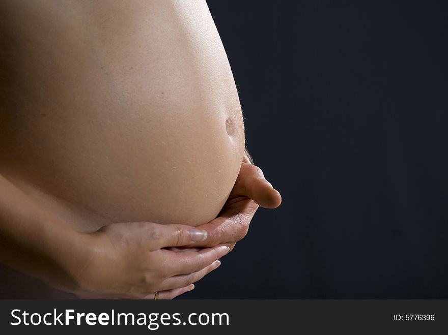 The stomach of young woman with child. The stomach of young woman with child.