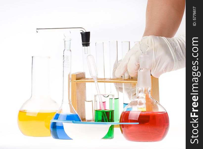 Various colorful glass laboratory ware on a white background. Various colorful glass laboratory ware on a white background