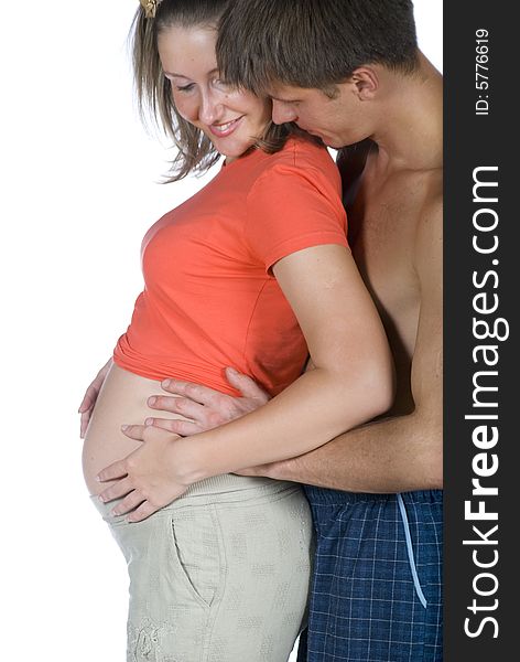 The young couple are waiting for their own baby against white background. The young couple are waiting for their own baby against white background