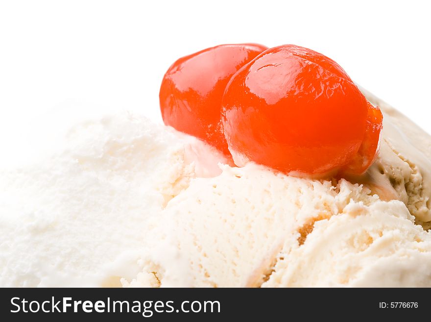 Ice-cream with a cherry in a glass on a white background. Ice-cream with a cherry in a glass on a white background.