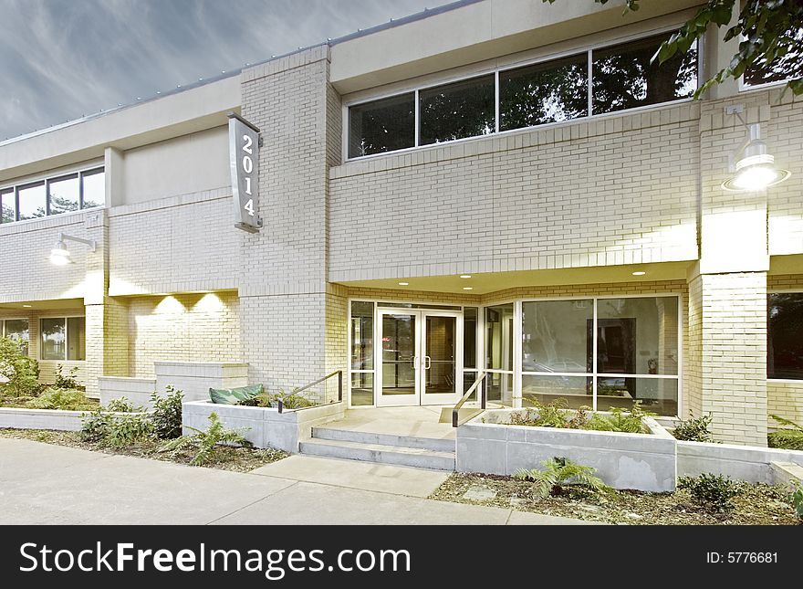 An office building with a empty parking lot