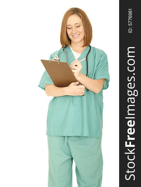 Shot of isolated on white of woman in medical uniform smiling and looking at her report on clip board. Shot of isolated on white of woman in medical uniform smiling and looking at her report on clip board