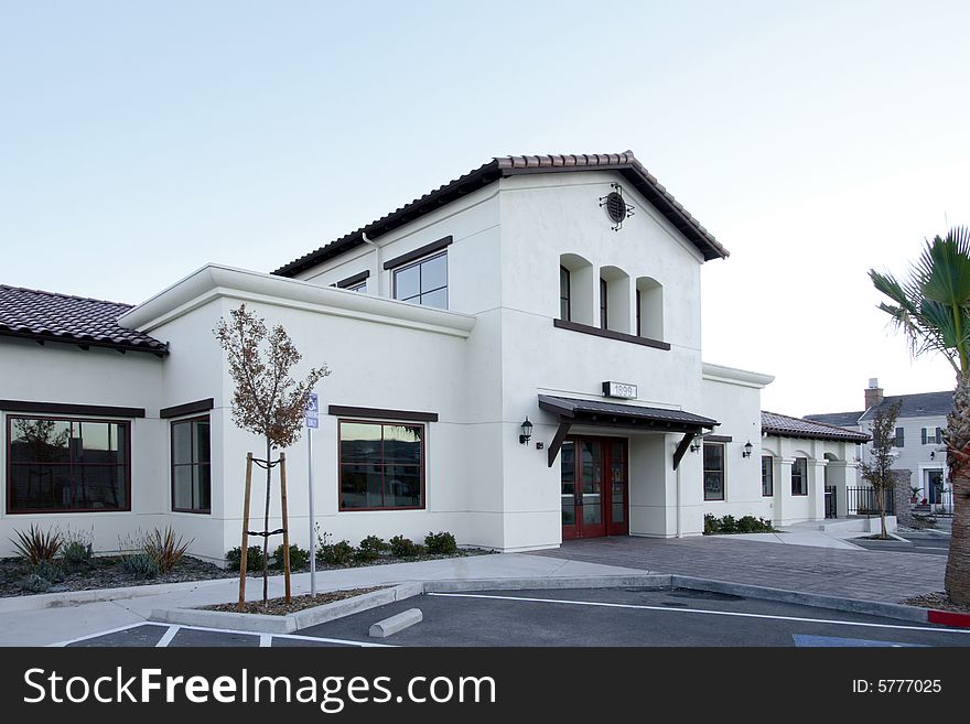 An office building with a empty parking lot