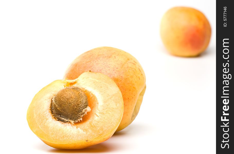 Fresh appetizing apricots on a white background. Fresh appetizing apricots on a white background