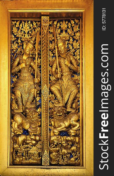 Thailand Bangkok; the wat Phra Kaew shelter the most sacred image of Thailand the Emerald Buddha. The temple is situated in the northeast corner of the Grand Palace. View of one golden window decoration. Thailand Bangkok; the wat Phra Kaew shelter the most sacred image of Thailand the Emerald Buddha. The temple is situated in the northeast corner of the Grand Palace. View of one golden window decoration