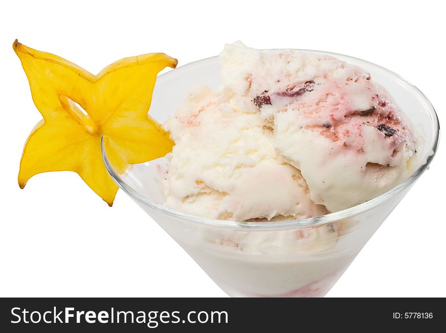 Ice-cream with slice of carambola in a glass on a white background. Ice-cream with slice of carambola in a glass on a white background.