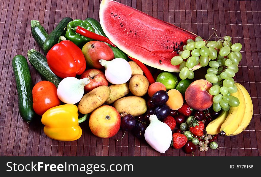 Vegetables and Fruits on brown background