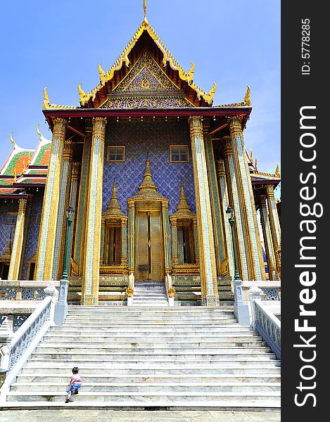 Thailand Bangkok; the wat Phra Kaew shelter the most sacred image of Thailand the Emerald Buddha. The temple is situated in the northeast corner of the Grand Palace. View of one entrance door. Thailand Bangkok; the wat Phra Kaew shelter the most sacred image of Thailand the Emerald Buddha. The temple is situated in the northeast corner of the Grand Palace. View of one entrance door