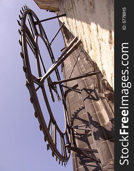 A close-up of a clock at a church tower