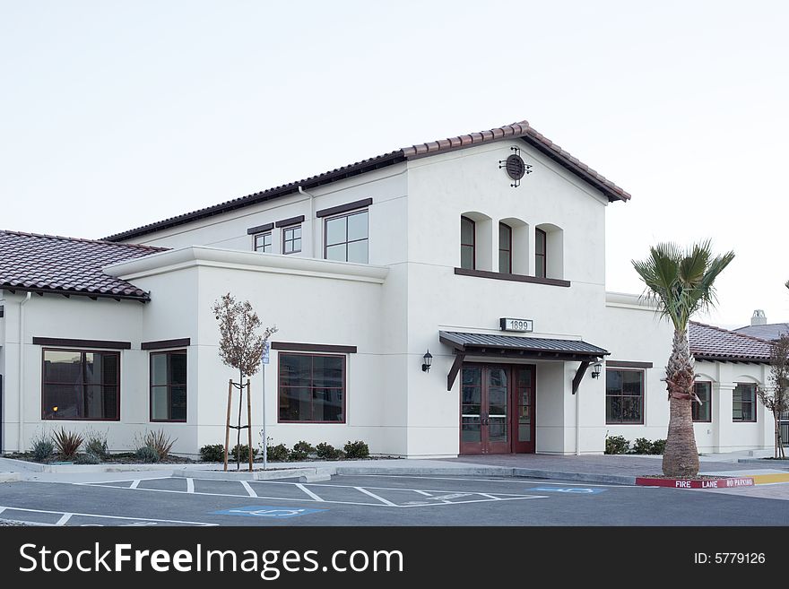 An office building with a empty parking lot