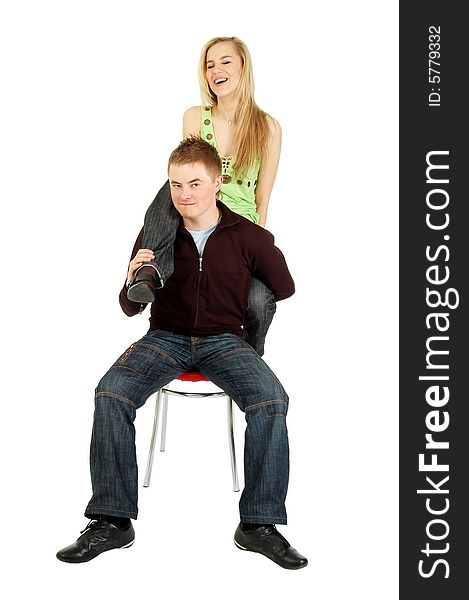 A sitting guy holds a girl's leg like cannon, isolated on white