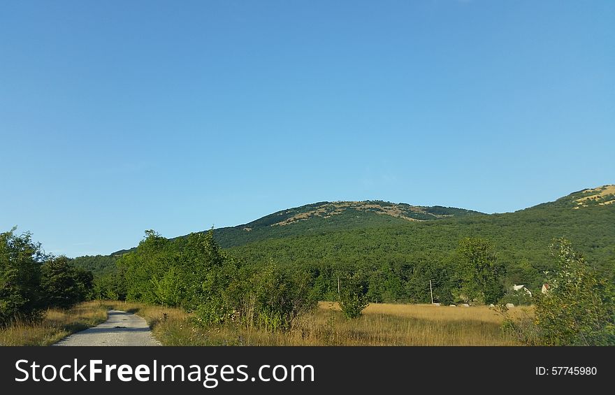 Old rural road and mountain views. Old rural road and mountain views