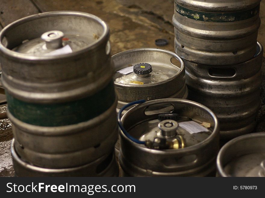 Tin barrels are filled by beer