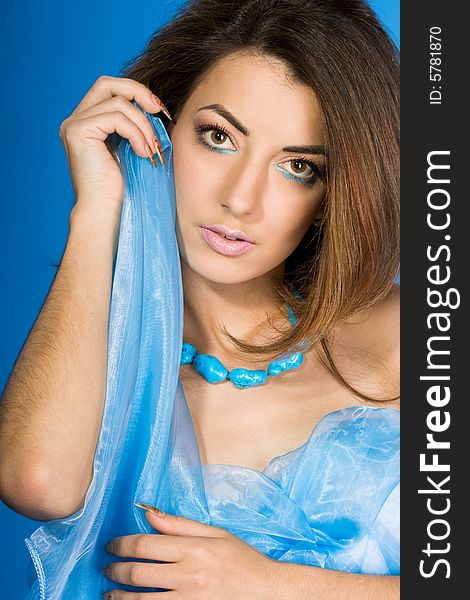 Beautiful woman with blue silk