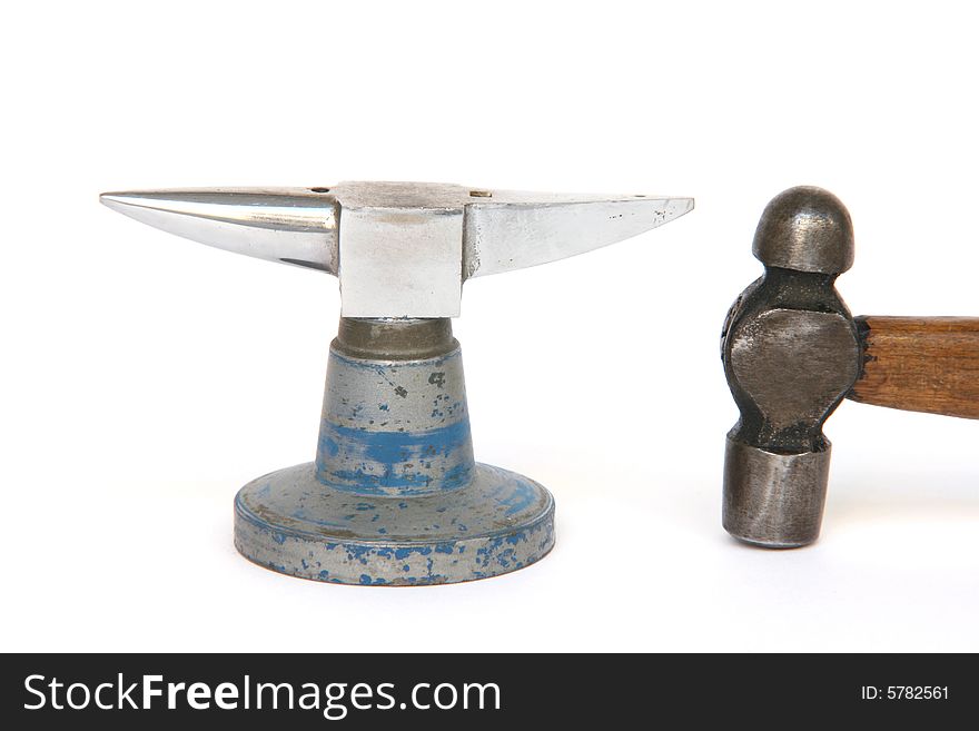 Small anvil and hammer from jewelry manufacture isolated