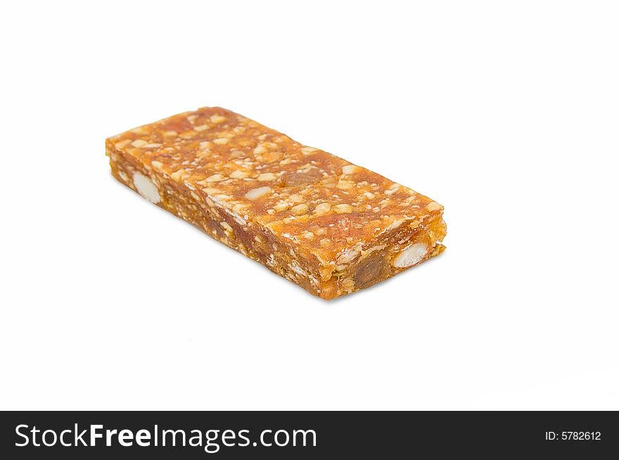 Pressed fruit stick with nuts and raisin