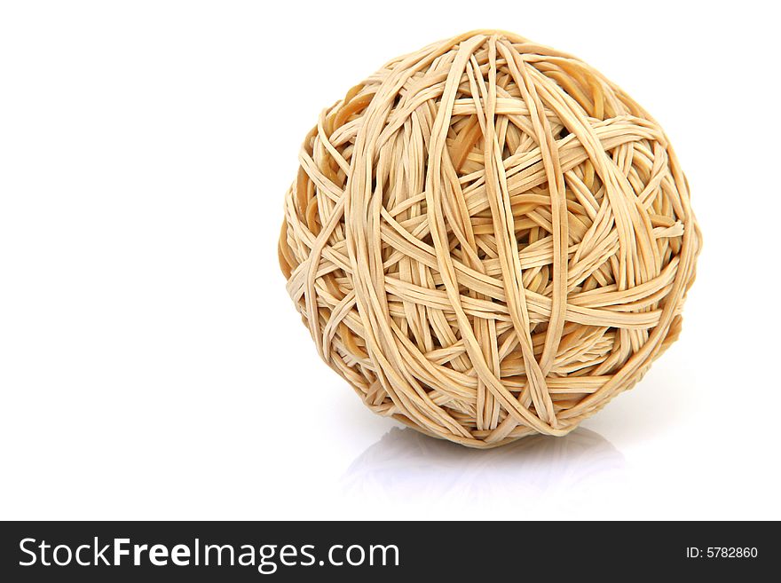 Ball made of rubber bands isolated on white background with small reflection. Ball made of rubber bands isolated on white background with small reflection