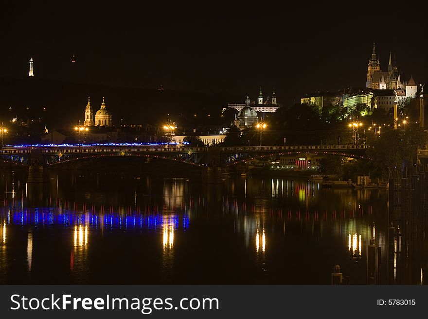 Panoramic night view to Lesser Town, Prague castle, St. Nicholas church and Petrin Tower. Panoramic night view to Lesser Town, Prague castle, St. Nicholas church and Petrin Tower.