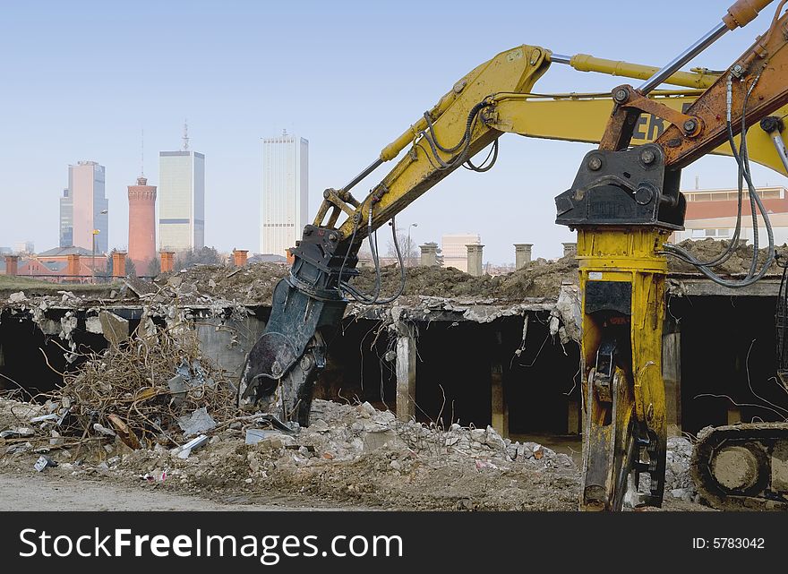 Diggers destroying building for new city. Diggers destroying building for new city