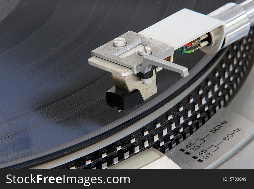 Closeup of old turntable with long play vinyl. Closeup of old turntable with long play vinyl