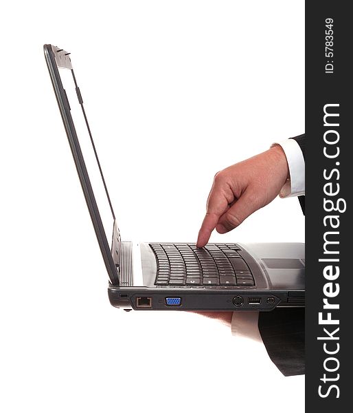 Businessman finger on the laptop's keyboard isolated