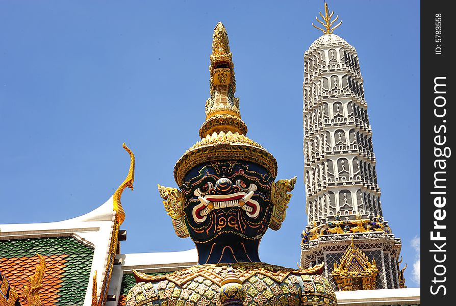 Thailand Bangkok; the wat Phra Kaew shelter the most sacred image of Thailand the Emerald Buddha. The temple is situated in the northeast corner of the Grand Palace. View of a giant or yakshas. Thailand Bangkok; the wat Phra Kaew shelter the most sacred image of Thailand the Emerald Buddha. The temple is situated in the northeast corner of the Grand Palace. View of a giant or yakshas