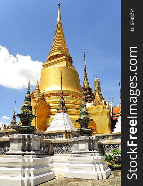 Thailand Bangkok; the wat Phra Kaew shelter the most sacred image of Thailand the Emerald Buddha. The temple is situated in the northeast corner of the Grand Palace. View of the golden stupas and phra. Thailand Bangkok; the wat Phra Kaew shelter the most sacred image of Thailand the Emerald Buddha. The temple is situated in the northeast corner of the Grand Palace. View of the golden stupas and phra