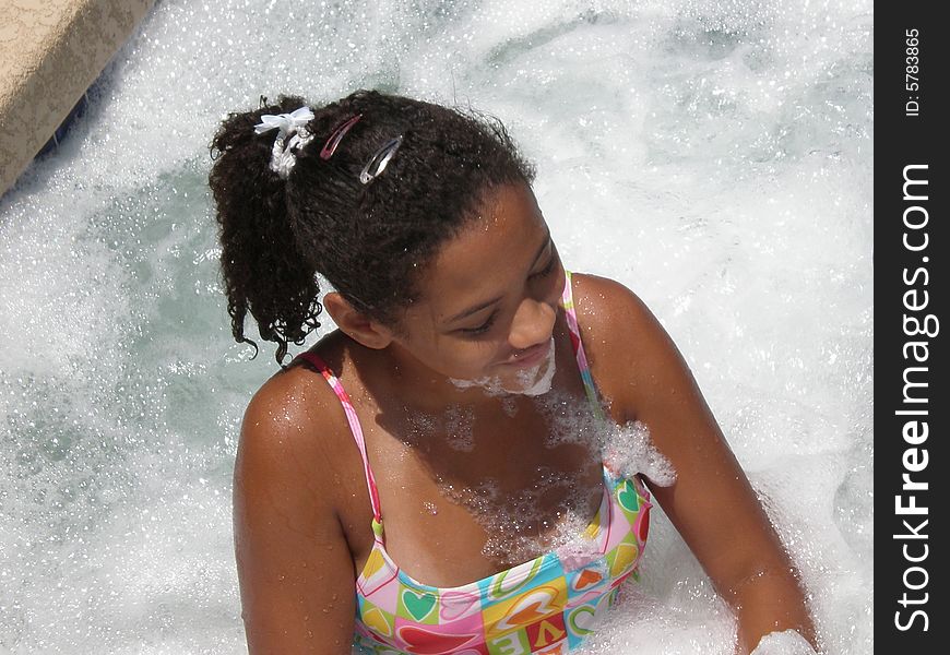 A picture of a young girl in a jacuzzi. A picture of a young girl in a jacuzzi.