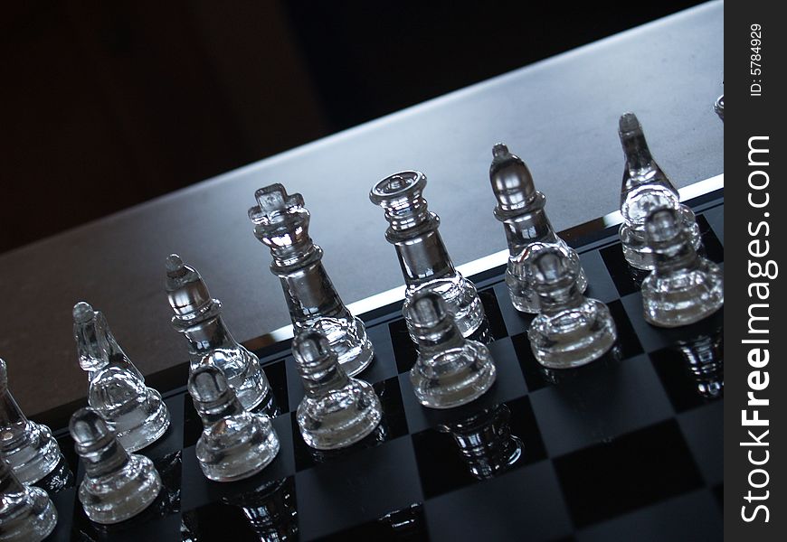 Glass chess pieces with light coming in. Glass chess pieces with light coming in