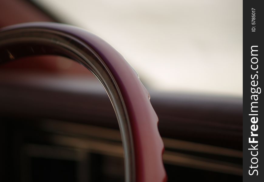 A steering wheel of a collector's car. A steering wheel of a collector's car