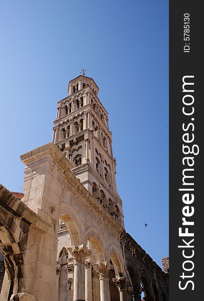 Great cathedral tower and roman columns in old town in Split, Croatia.