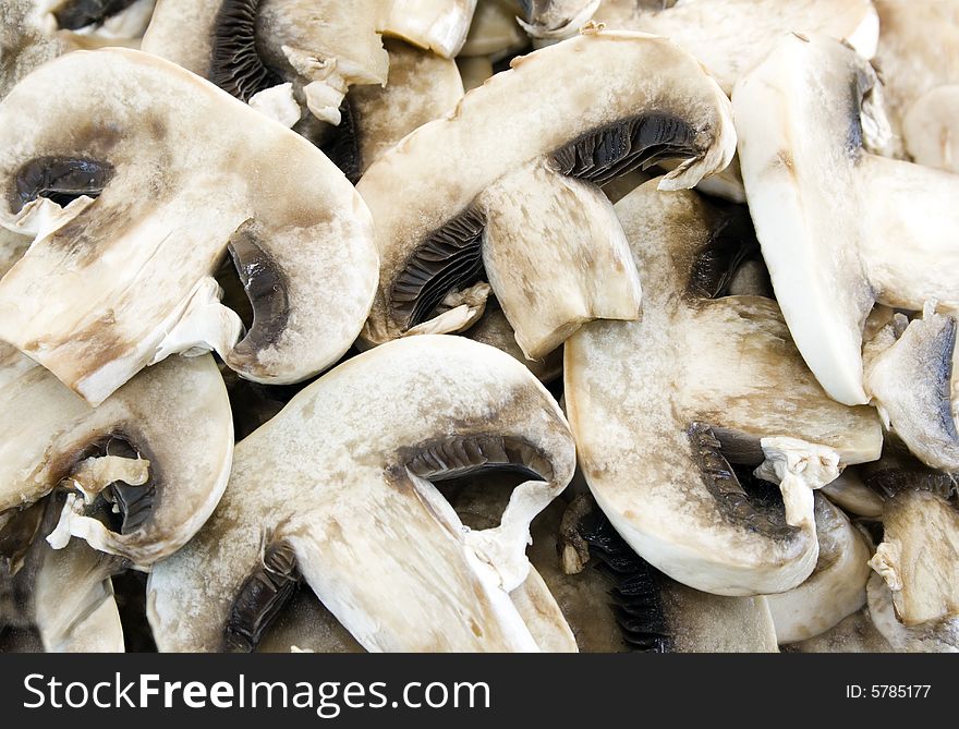 Sliced mushrooms close up. Focus on the mushrooms at the front.