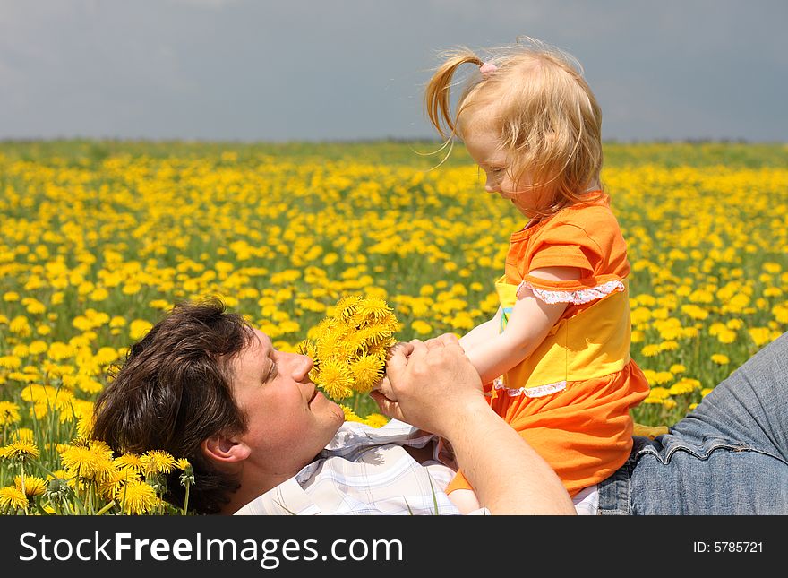 Father and daughter on meadow. Father and daughter on meadow