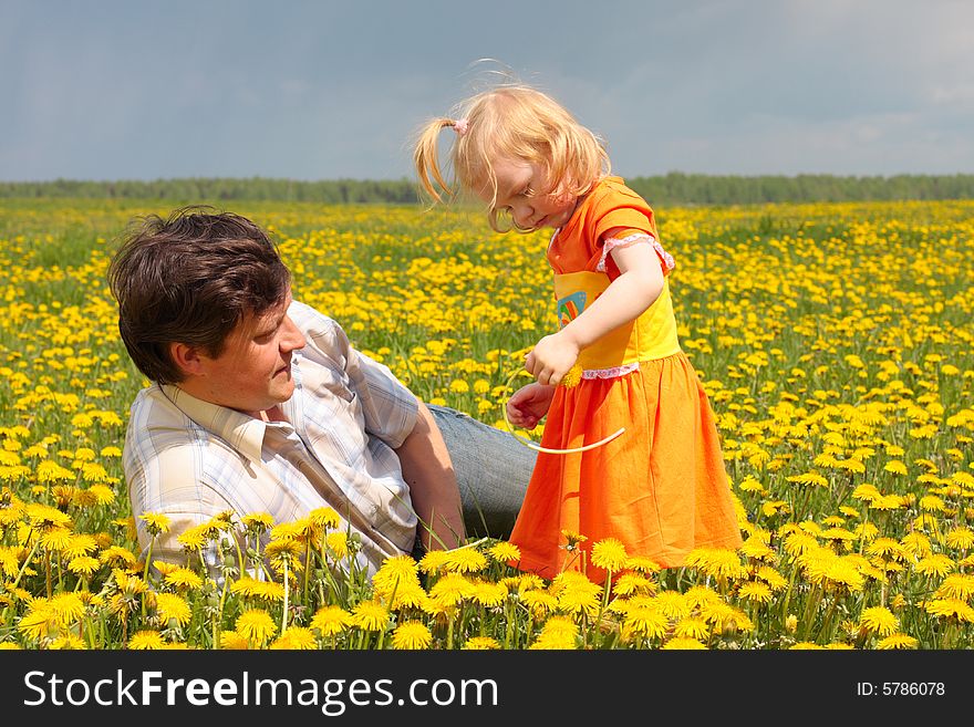 Father and daughter on meadow. Father and daughter on meadow