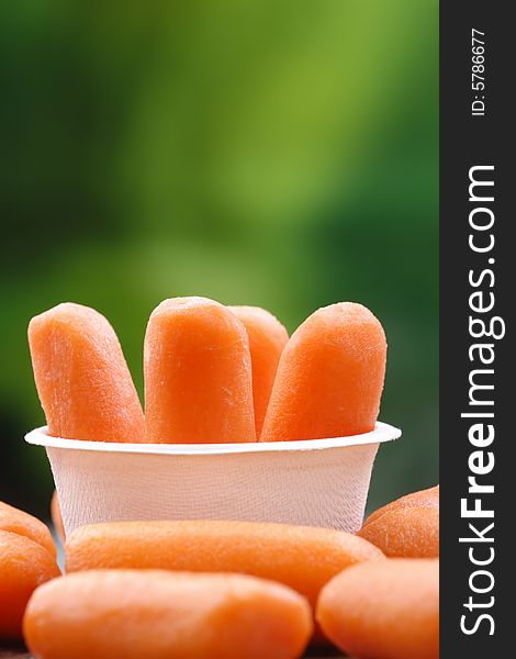Organic peeled carrots in a recyclable bowl.