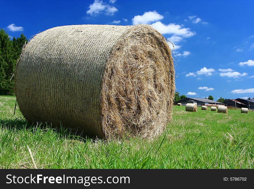 Sumer image: hay bales near a farm