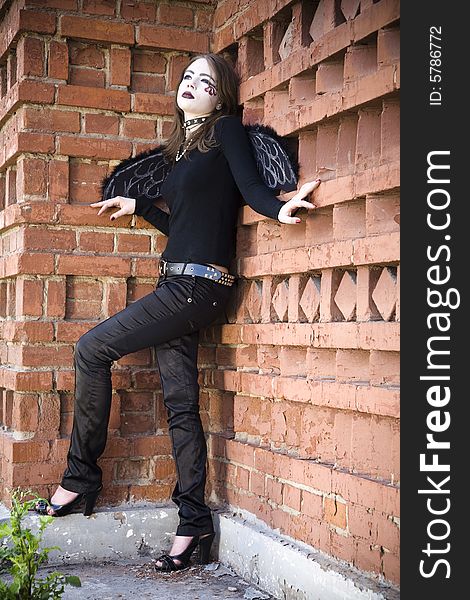 Gothic Angel Against Brick Wall