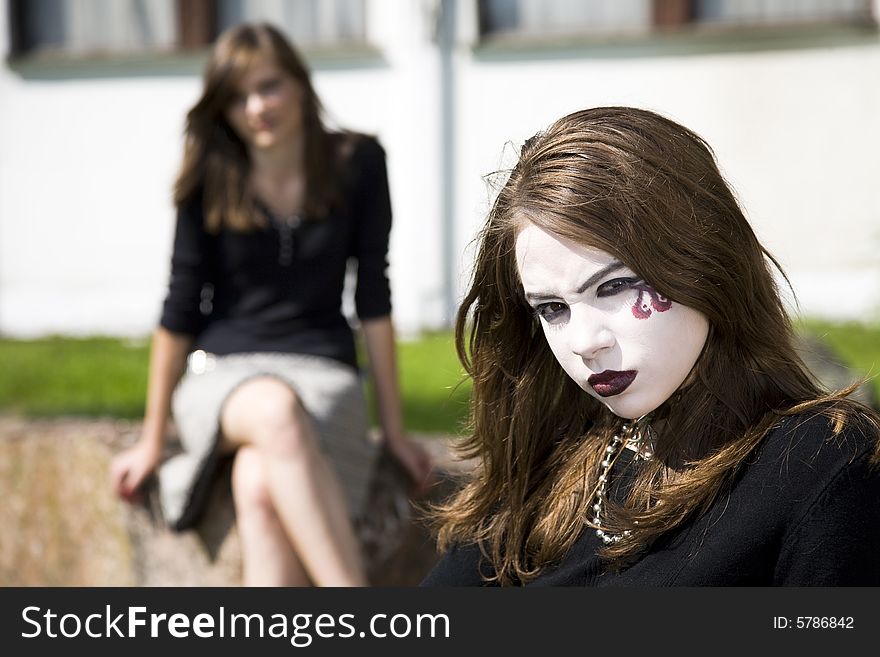 Modern Teenager Culture. Two Teenage Girls Outdoors.