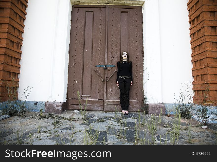 Gothic Style Girl Near A Door