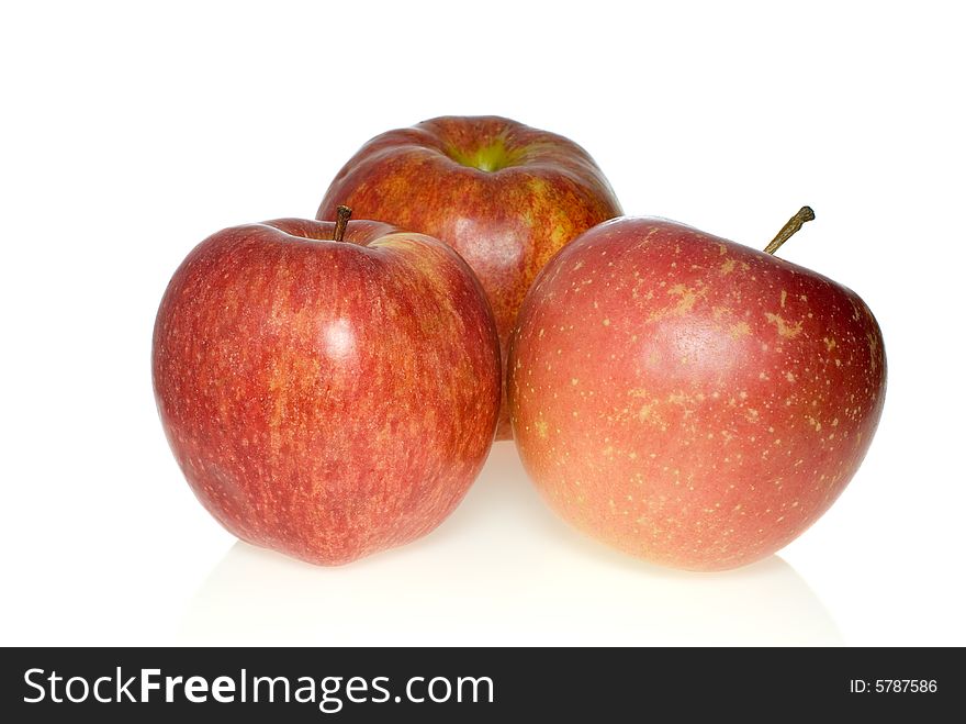 Three red apples of different breeds isolated on the white background